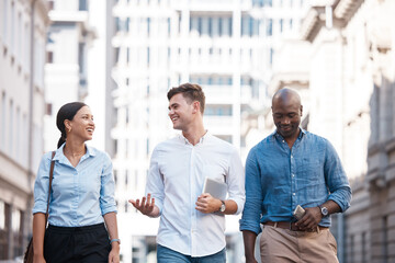 Business people, friends and city group walking, talking and chatting about work project while outside on an urban street. Diversity, happy and employees planning, traveling and social on commute