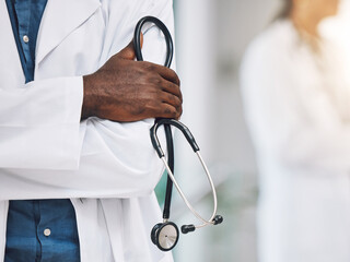 Healthcare, stethoscope in hand and African doctor in hospital. Black man or medical worker, leader...