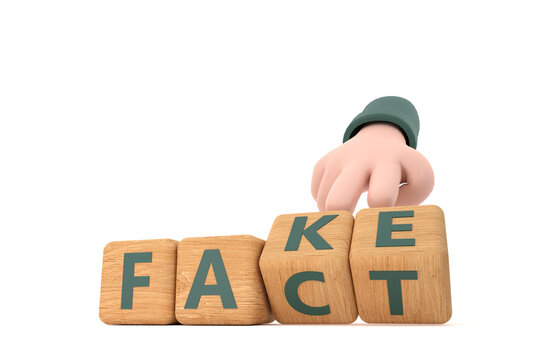 Hand turns dice and changes the word "fake" to "fact".