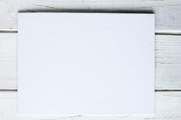 White canvas list over a white table
