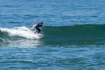 Surfer girl riding a wave