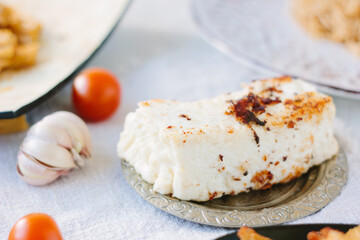 roasted paneer on a metal plate, ready to eat