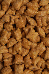 Chocolate pillows close up. Breakfast cereals isolated on white background.