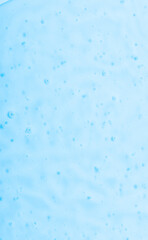 Cosmetic gel close-up with oxygen bubbles. Textured background with microbrushes in cosmetics. Moisturizing skin serum with vitamins and collagen.