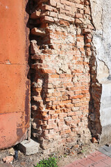 Brick wall of an old ruined house