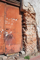 Brick wall of an old ruined house