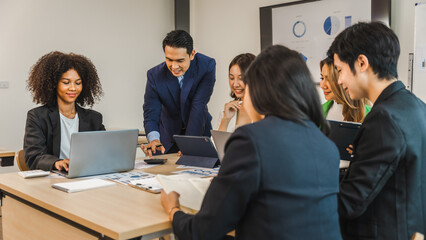 Mix race young start up business people meeting at office desk in modern workplace.