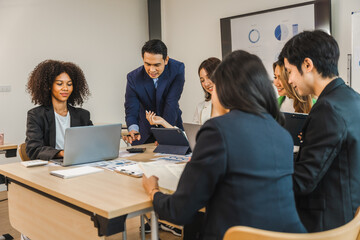 Mix race young start up business people meeting at office desk in modern workplace.