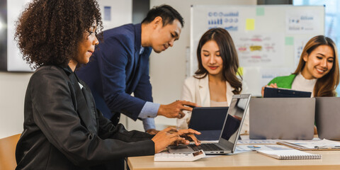 Mix race young start up business people meeting at office desk in modern workplace.