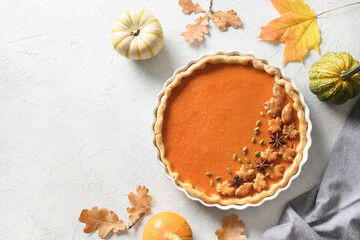 Thanksgiving Day American Pumpkin Pie decorated anise stars on white background. View from above. Flat lay. Copy space.