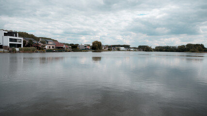 Fototapeta na wymiar Lake in Berlare, Belgium, on a cloudy summer day