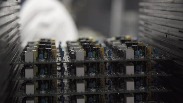 Removing one circuit board from the circuit board holder. Close-up