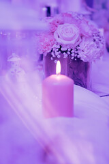 Candle and flowers in pink