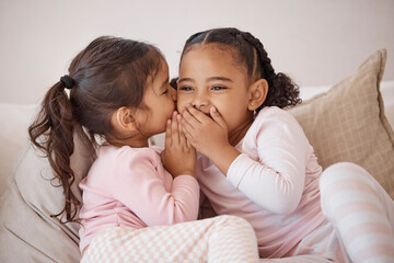 Girl, friends or children whisper secret to best friend on home sofa while relax together on play...