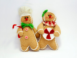 Christmas dolls in the shape of a gingerbread man. Christmas ornament to decorate or hang on the Christmas tree. Toys. soft dolls. Coookies. Chefs.