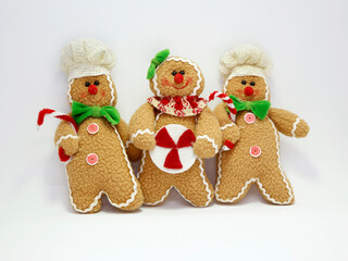 
Christmas dolls in the shape of a gingerbread man. Christmas ornament to decorate or hang on the Christmas tree. Toys. soft dolls. Coookies.  Chefs.