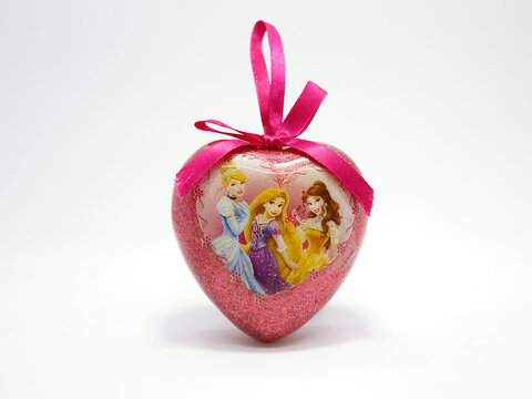 Disney princesses. Aurora from Cinderella, Rapunzel, and Belle from beauty and the beast. Characters from classic children's stories. Christmas ornament to hang on the Christmas tree. Pink heart