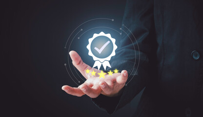 Businessman holding sign of the top service five star Quality assurance, Standard quality control , ISO certification and standardization, Guarantee concept.