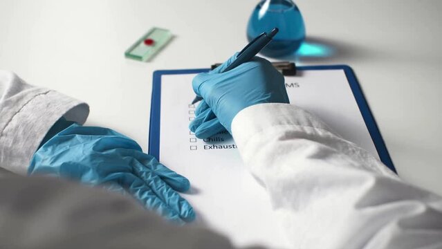 Monkeypox virus, its symptoms noted by doctor on medical tablet. World pandemic of monkeypox infection. Monkeypox disease caused by infection with virus. Healthcare in  UK, Africa, Europe, America