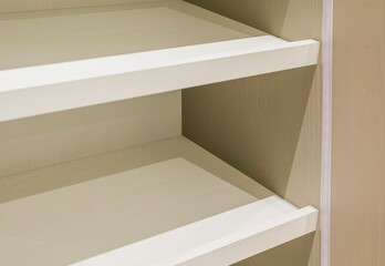 Obraz premium White shelves of the new cabinet