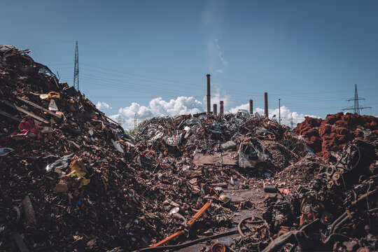 junkyard with factory in background