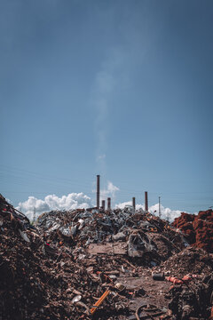 junkyard with factory in background