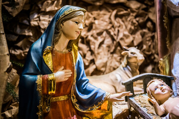 Fototapeta na wymiar nativity scene in church. Jesus and Maria and Joseph
