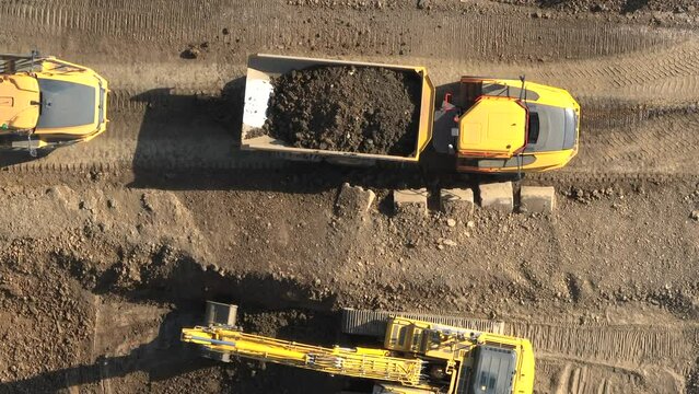 Tipper Truck Being Loaded Up With Earth by a Digger