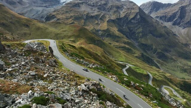 Aerial view of famous Grossglockner Hochalpenstrasse - Scenic Alpine road in Austria. Motorcyclists and car travelers.