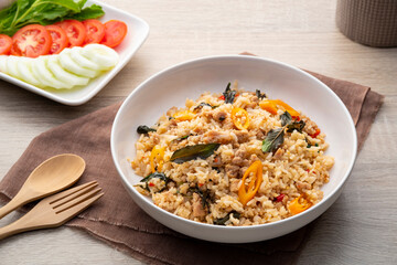 Thai Fried rice with minced pork and basil on white plate(khao pad kaprao moosub)