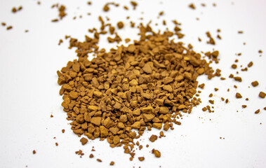 Coffee black instant on an isolated white background. Granules of instant natural coffee.