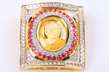 Fototapeta na wymiar Golden Buddha Pendant Jewel on white Background