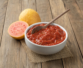 Goiabada, traditional brazilian creamy guava sweet with fruits over wooden table