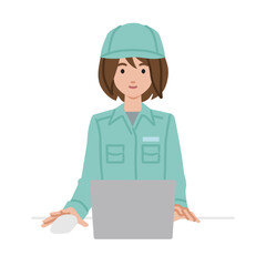 デスクで座ってPCを使っている作業員の女性