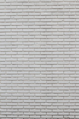 Background image vertical striped brick wall painted white, visible fine textures.