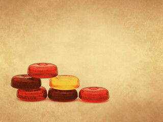 Colorful fruit hard candy on old paper background