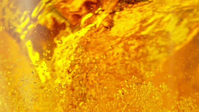 Super Slow Motion Shot of Golden Beer or Cider Vortex at 1000 fps.