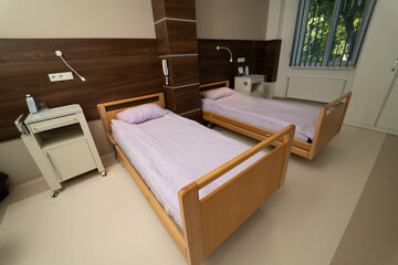 Medical ward with comfortable bed. Empty modern recovery room.