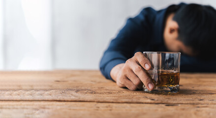 Alcoholism concept. Young man drinking alcohol too much. drunk asian man hold whisky glass addicted...