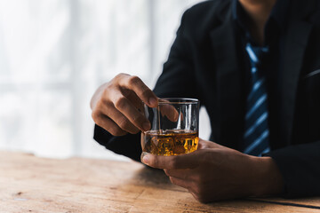 Alcoholism concept. Young man drinking alcohol too much. drunk asian man hold whisky glass addicted alcohol need therapy.