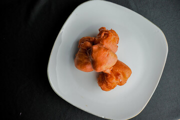 Orang-orang cake is a typical snack from Indonesia. Made from a mixture of wheat flour and bananas, then fried.