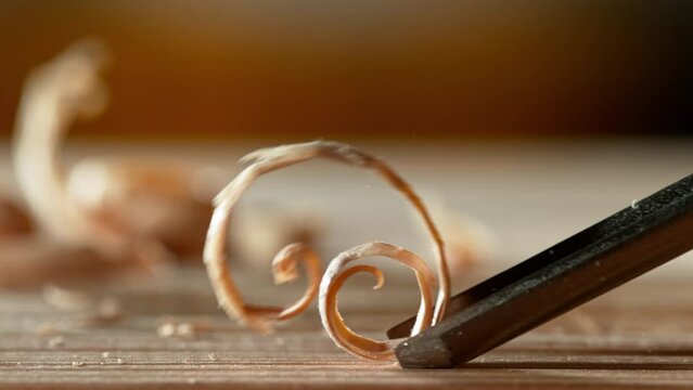 Carpenter planing with chisel, super slow motion. macro. Filmed on high speed cinema camera, 1000 fps.