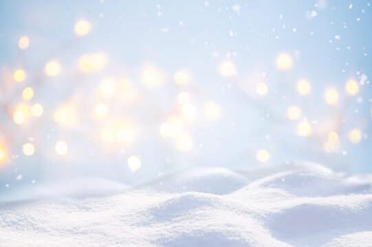 Beautiful background image with small snowdrifts close-up and blurry holiday lights.