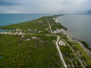 Obraz premium Caye Caulker island in Belize. Cloudy Morning Sky and Caribbean Sea in Background.