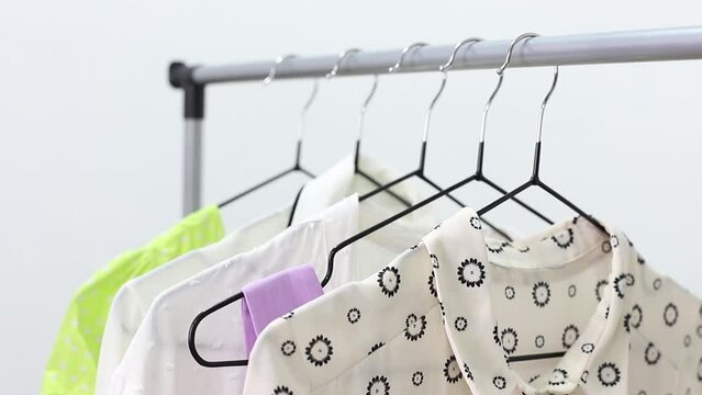 clothes on hangers in the wardrobe close-up. shopping. bayer