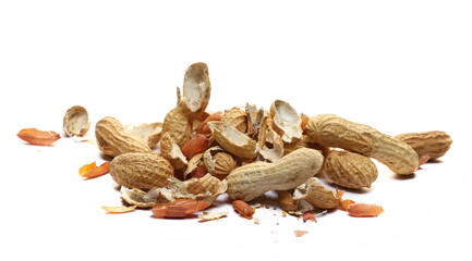 Shelled and unshelled peanuts pile isolated on white