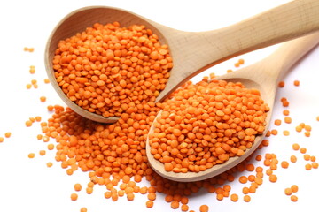 Red lentils pile isolated on white  