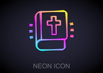 Glowing neon line Holy bible book icon isolated on black background. Vector