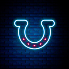 Glowing neon line Horseshoe icon isolated on brick wall background. Colorful outline concept. Vector