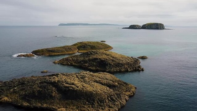 mini rock islands in ocean, ocean waves